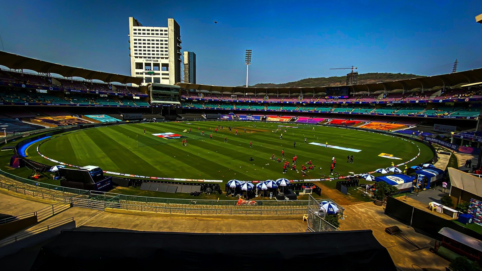 a sports field with a crowd of people in the stands